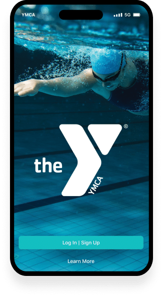 A mobile phone displaying the login screen of the YMCA app. The background image shows a swimmer underwater, wearing a blue swim cap, moving through the pool with a dynamic stroke. The app features a large white 'Y' logo in the center and buttons for 'Log In | Sign Up' and 'Learn More' at the bottom